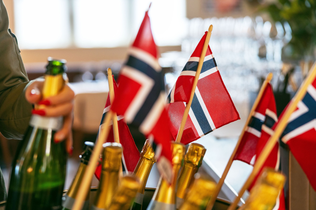 celebrate 17th May at Tollbua, with champagne bottles and Norwegian flags