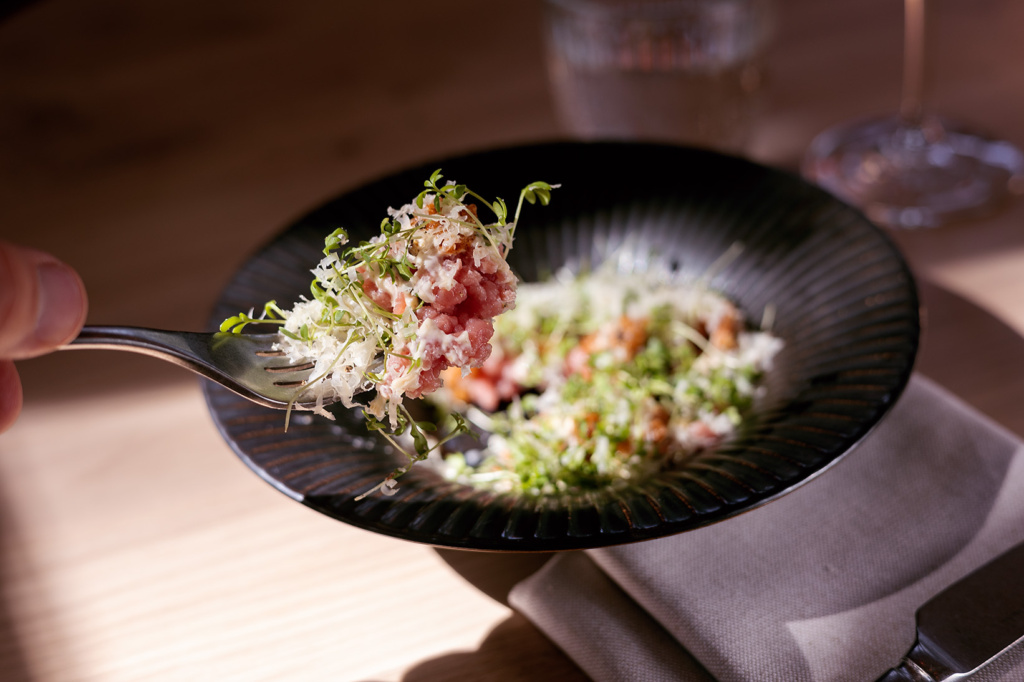 tartar dishes being eaten on a spoon at Tollbua restaurant